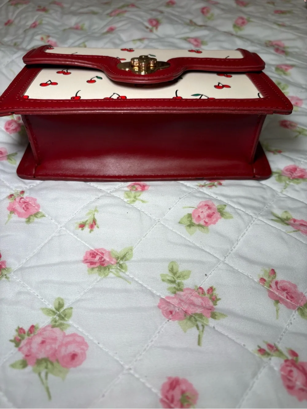 Cherry-Print Cream and Red Top-Handle Clutch